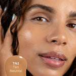 Close-up of a woman's face with TN2 shade 