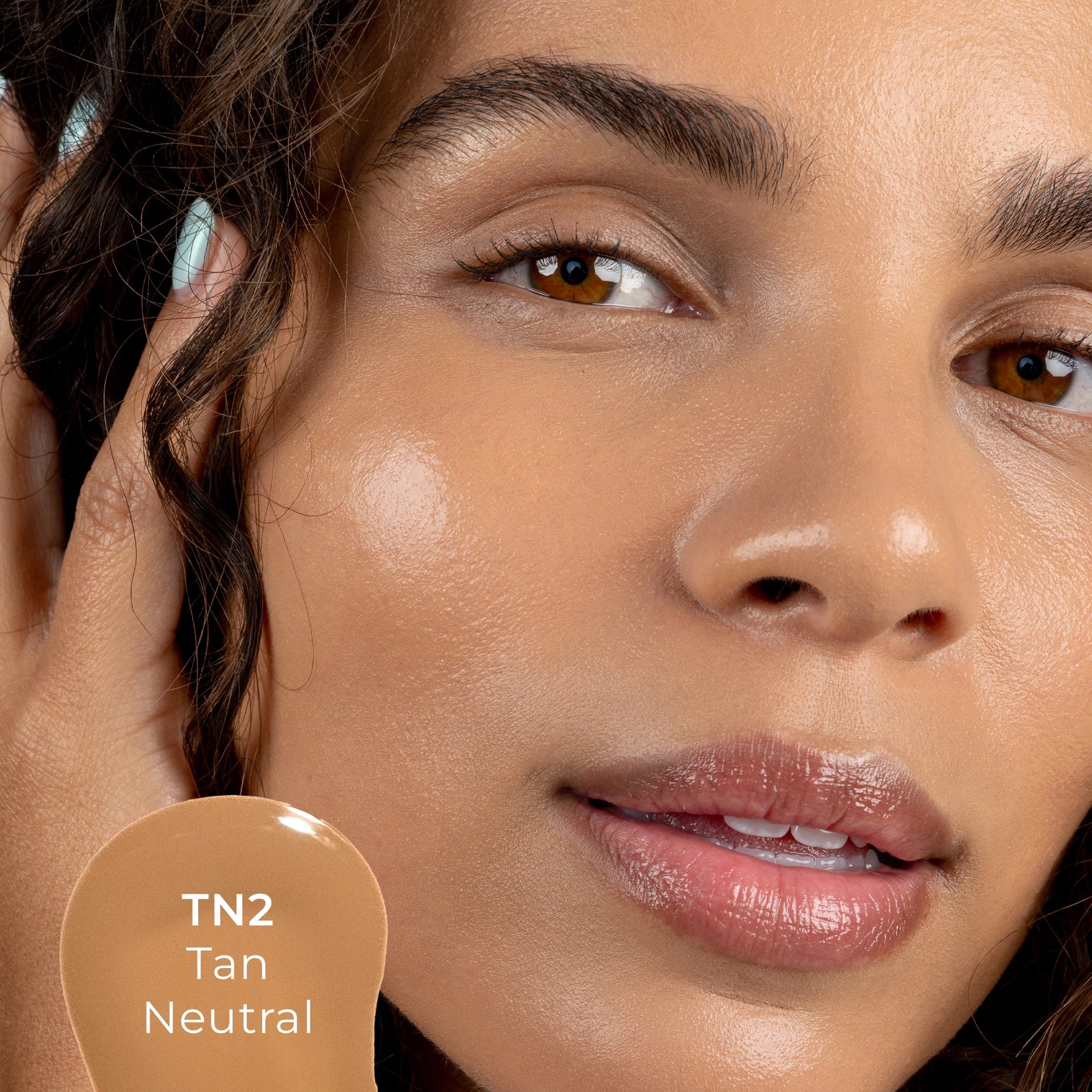 Close-up of a woman's face with TN2 shade 