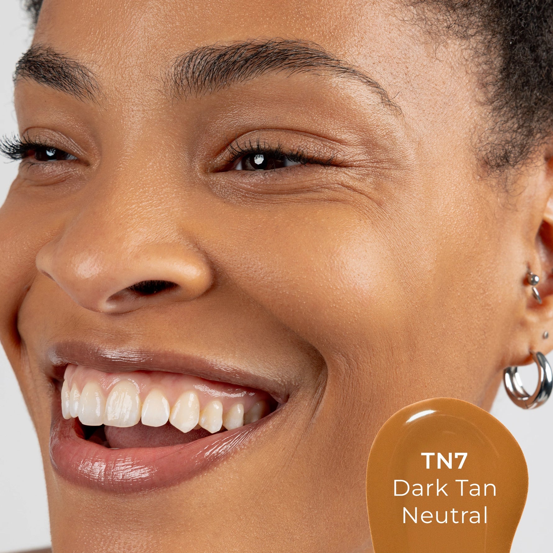 Close-up of a woman's face with TN7 shade 