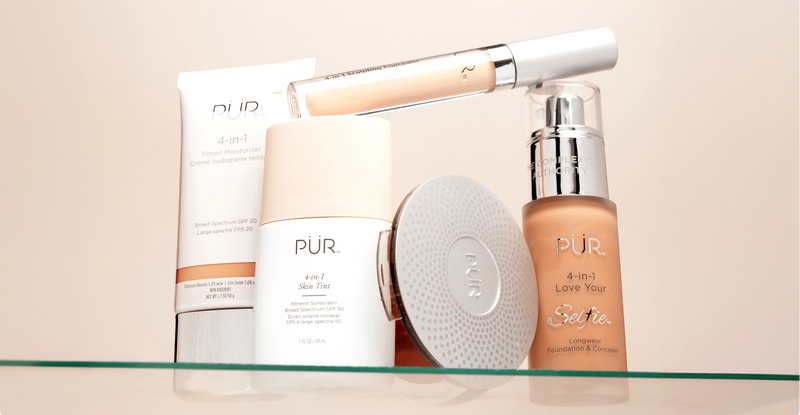 PÜR Anniversary Sale 2026 - 35% Off Sitewide: Various makeup bottles and containers on glass shelf against cream background